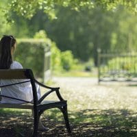 How to Have a Daily Quiet Time | The Navigators Bible Study Resources | A woman relaxing in a green garden