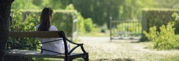 How to Have a Daily Quiet Time | The Navigators Bible Study Resources | A woman relaxing in a green garden