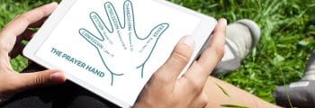 The Prayer Hand | The Navigators Evangelism Resources | Prayer hand illustration in a notebook on a table