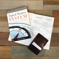 Topical Memory System (TMS) | The Navigators | Picture of the Topical Memory System (scripture memorization resource) on a wooden desk