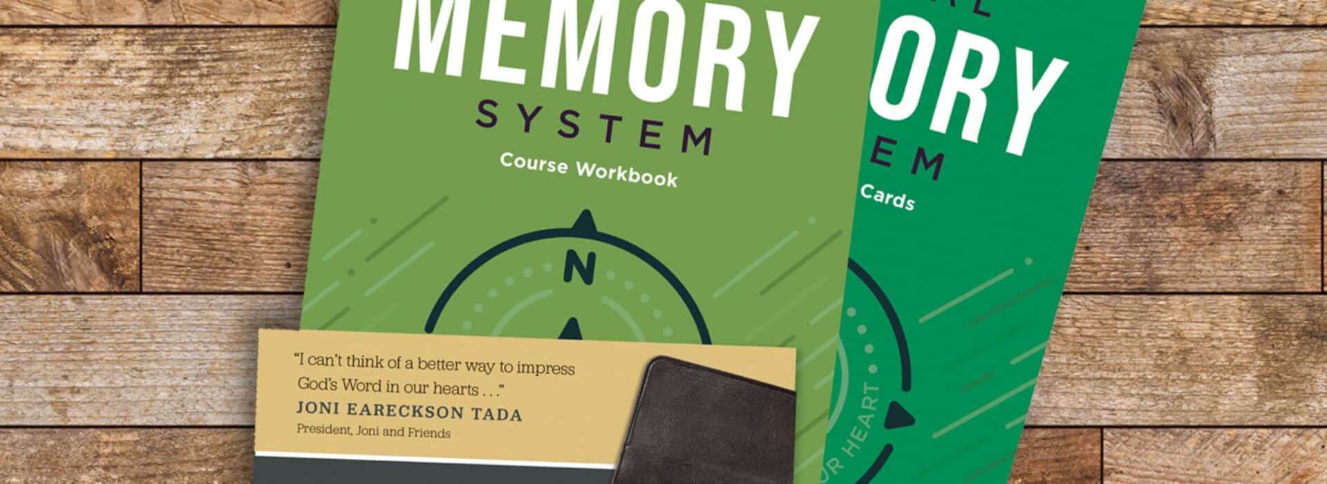 Picture of the Topical Memory System (scripture memorization resource) on a wooden desk