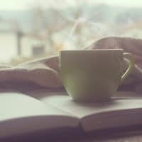 Inductive Bible Study | The Navigators Evangelism Resources | coffee cup on a bible on a coffee table
