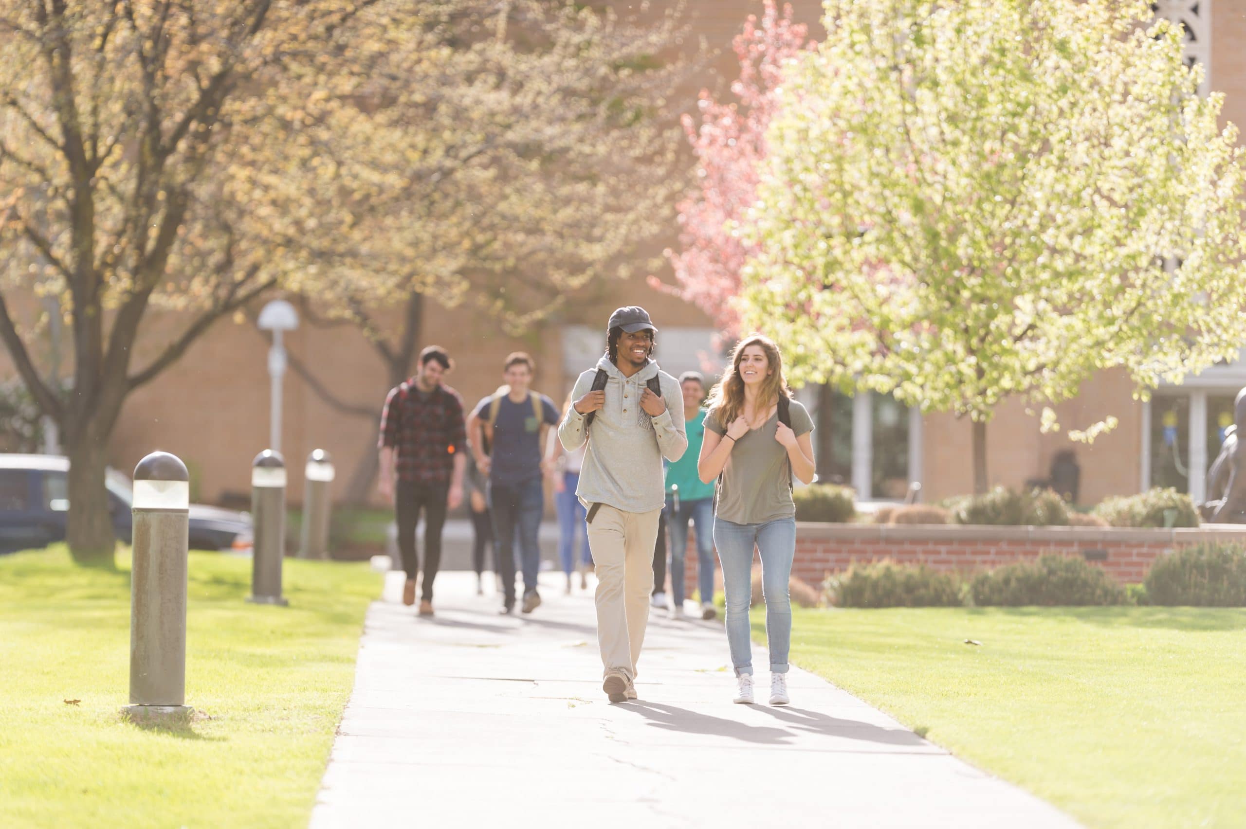 4 Ways to Pray for College Campuses | Navigators Prayer Resource | A pair of college students walk across campus to their next class