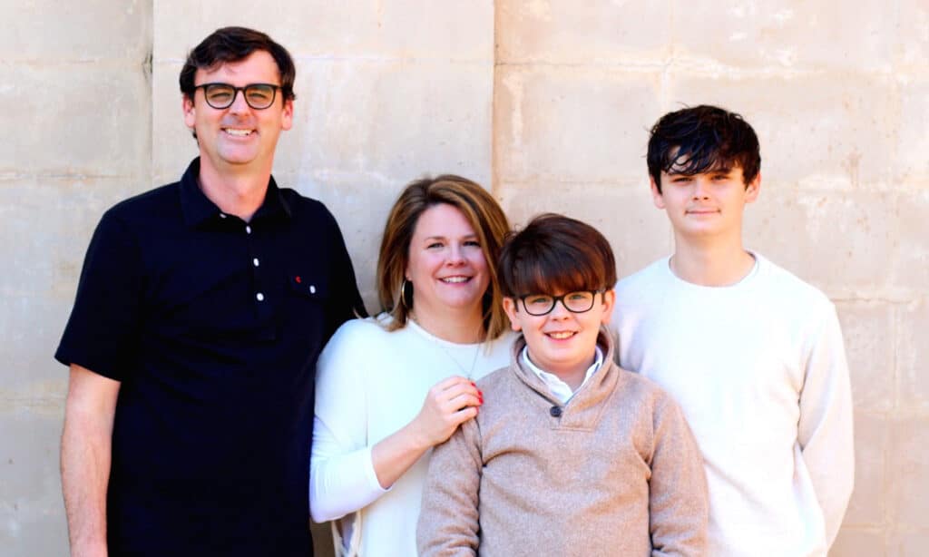 Lesley Wolf, a Navigators staff member, and her family posing for a picture.