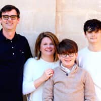 Lesley Wolf, a Navigators staff member, and her family posing for a picture.