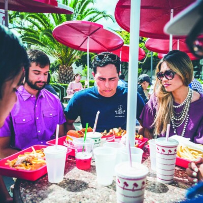 Reaching College Students | The Navigators Evangelism Stories | college students eating fast food outside at a covered table