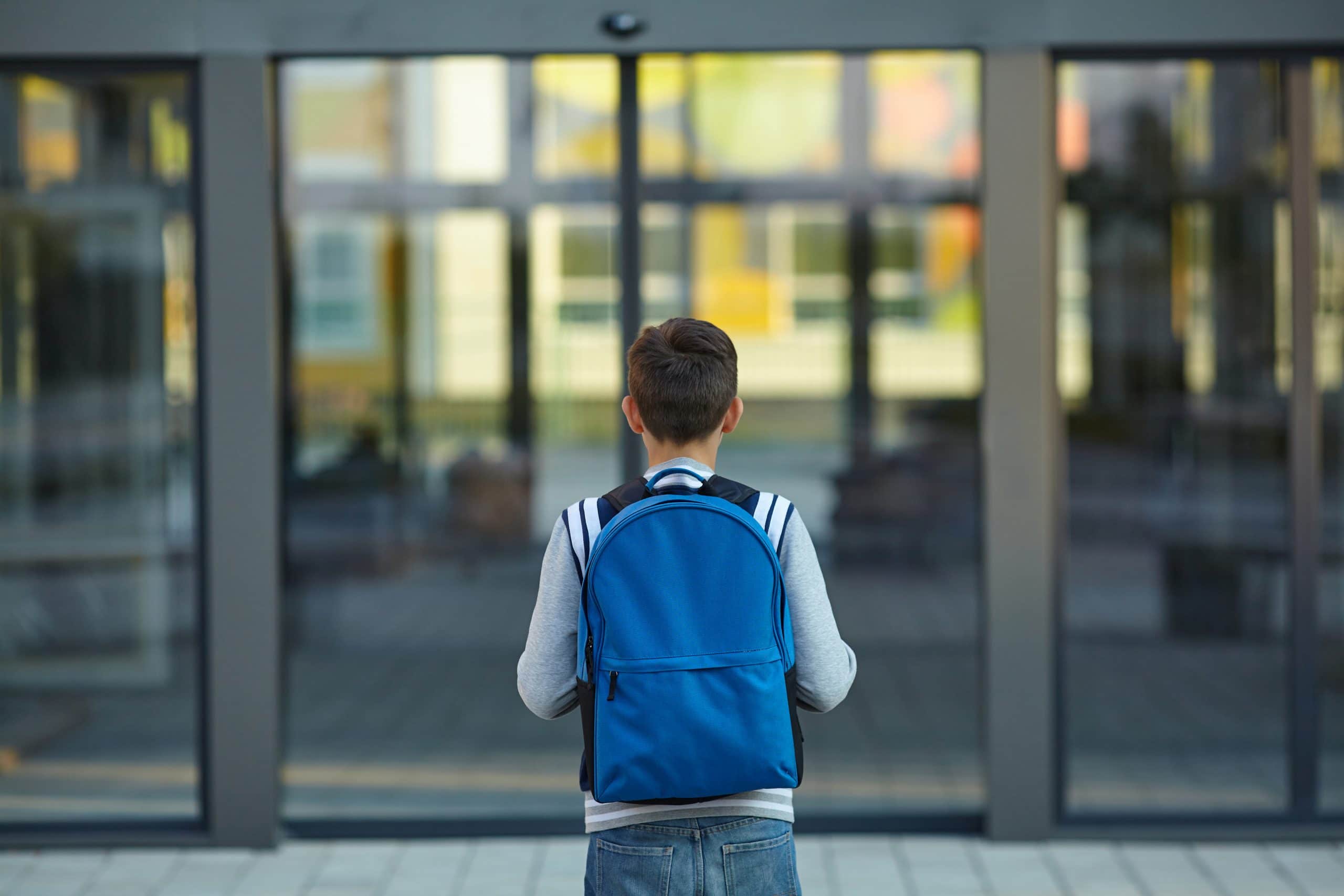 Unexpected Fruit Lesley Wolfe Navigators Neighbors Boy in front of school