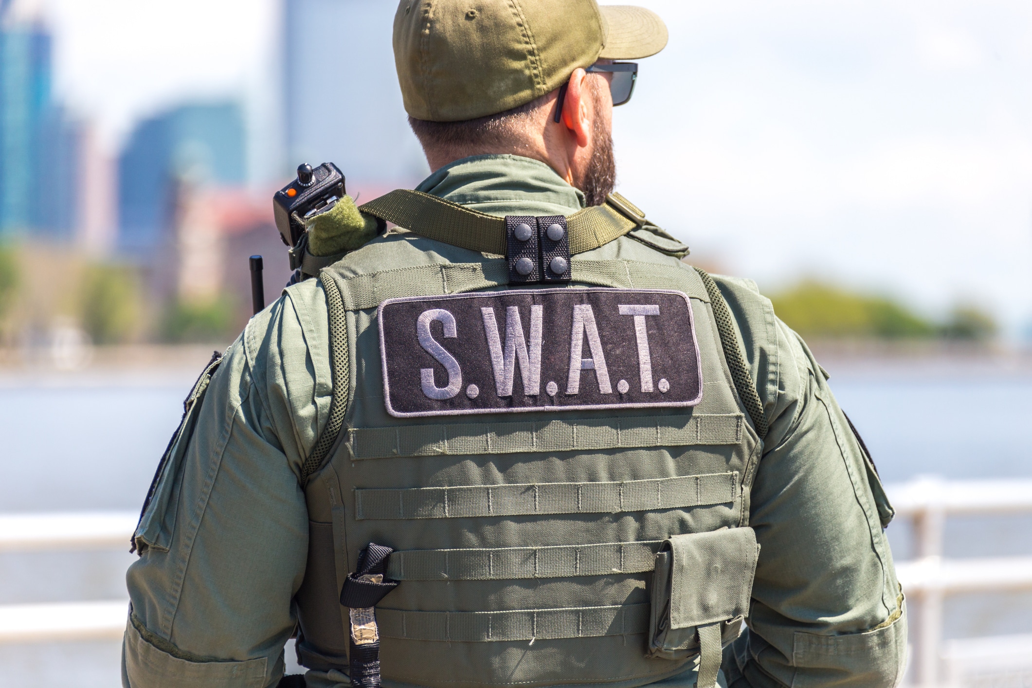 Inside the Heart of Law Enforcement: Jesus Offers Real Hope | Navigators First Responders Ministry | equipped SWAT soldier standing on a pier