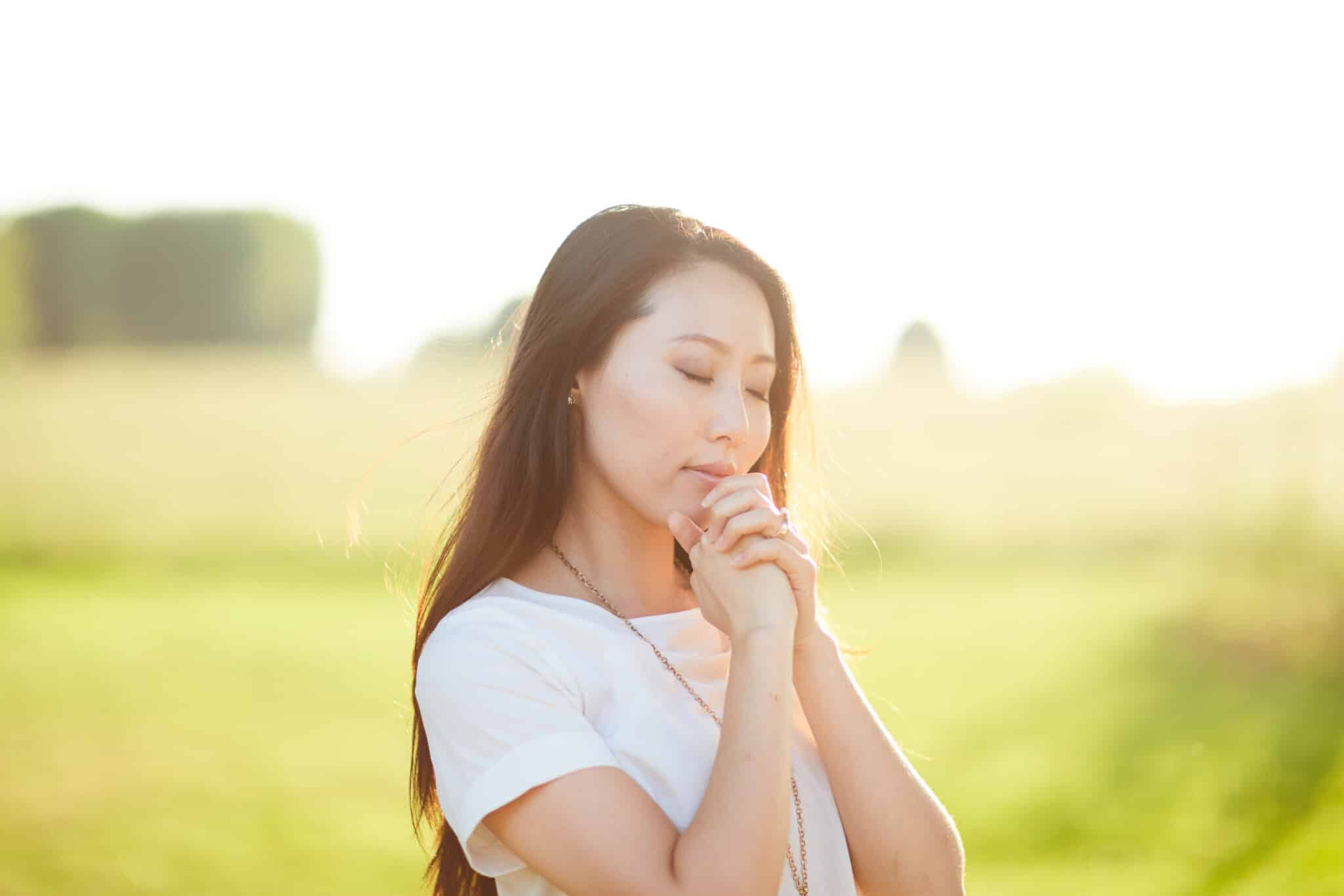 Practicing God's Presence in Prayer | Prayer Resource | The Navigators | a woman praying outdoors