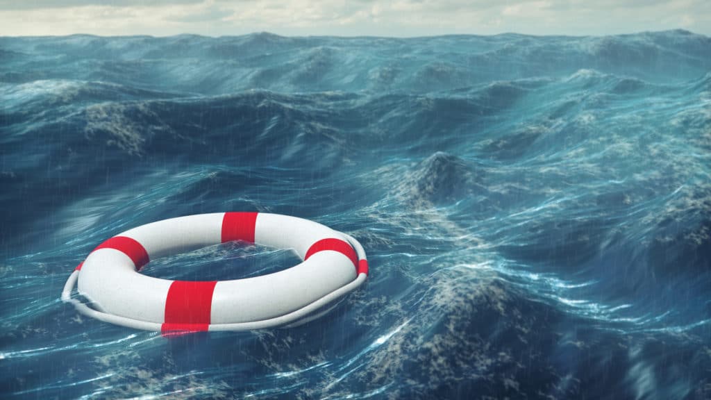 Buoyant in Turbulent Times | Doug Nuenke | Floating lifebuoy on a stormy sea.