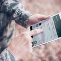 Life-to-Life Disciplemaking Continues to Grow Online | US military soldier using WhatsApp on a digital tablet