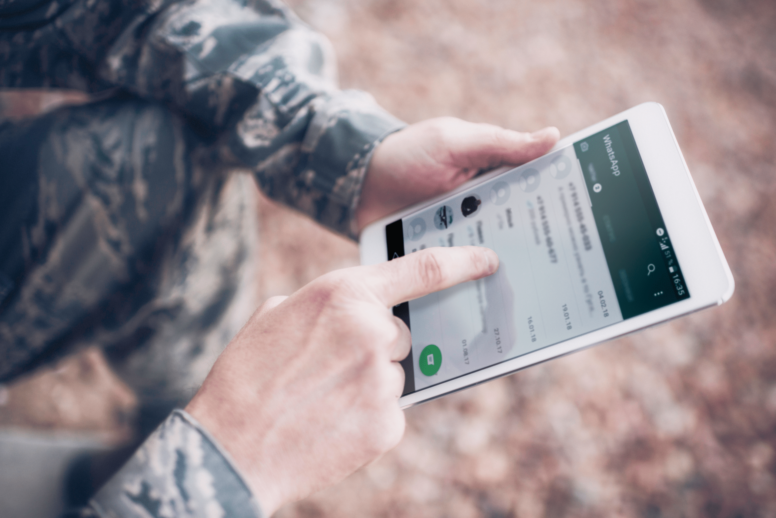 Life-to-Life Disciplemaking Continues to Grow Online | US military soldier using WhatsApp on a digital tablet