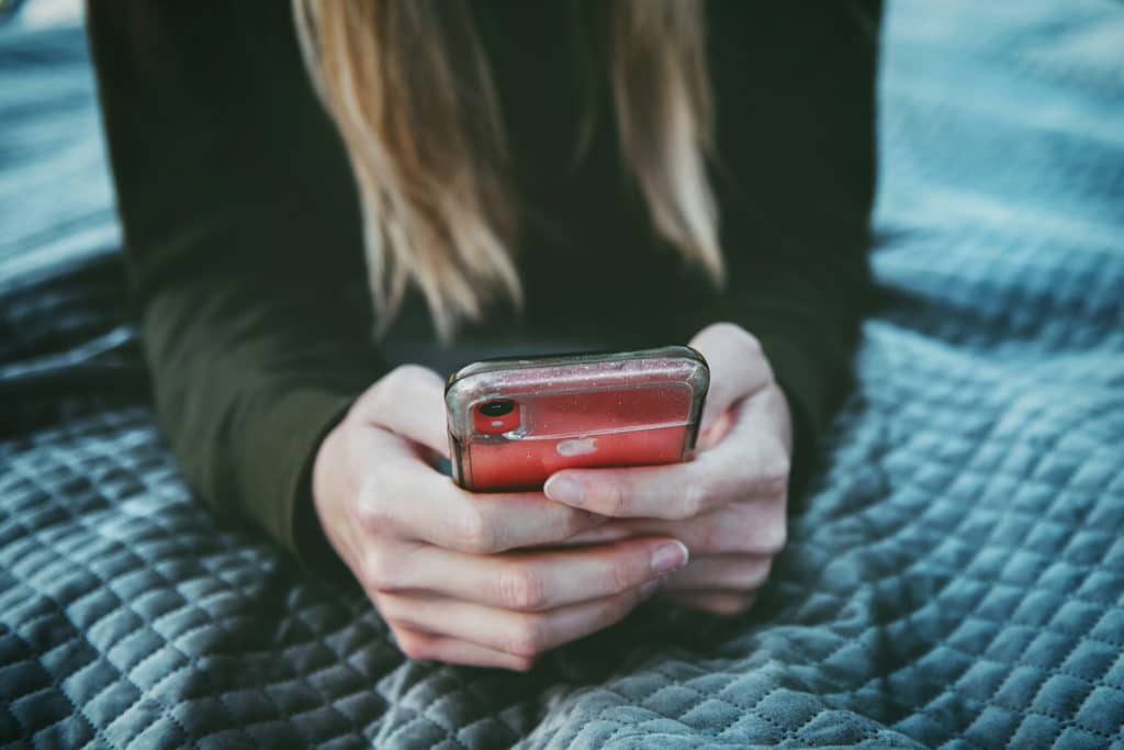 Woman holding cell phone