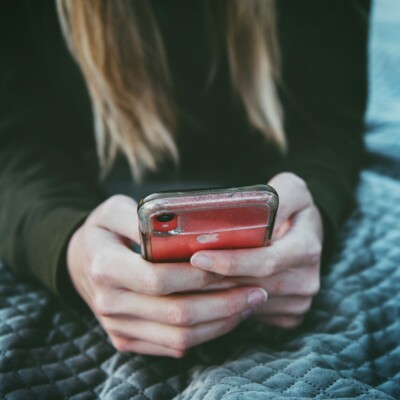 Woman holding cell phone
