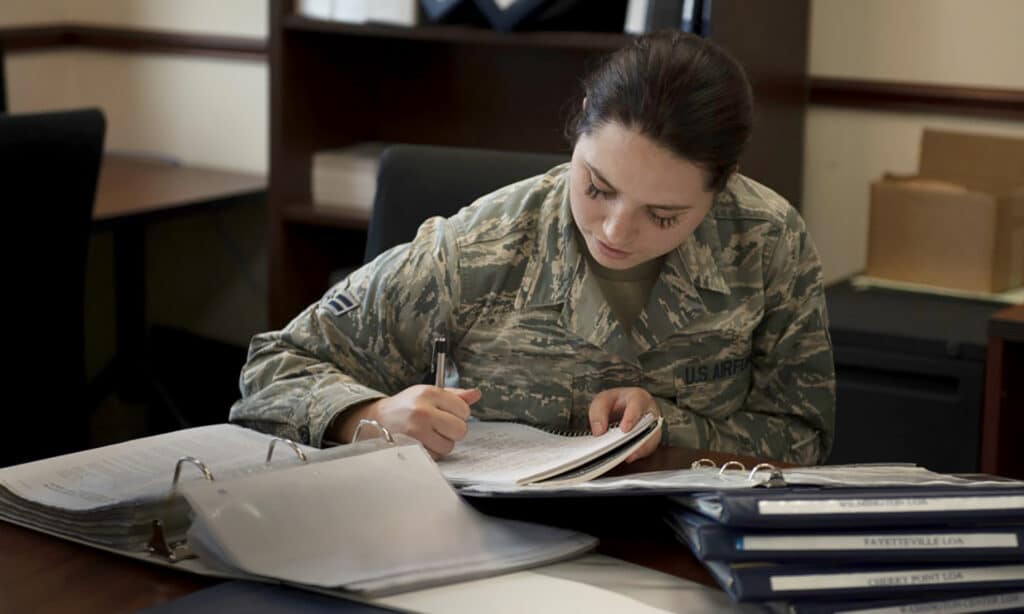 Hope in the Desert | Navigators Military | Woman in uniform writing in notebook