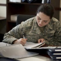 Hope in the Desert | Navigators Military | Woman in uniform writing in notebook