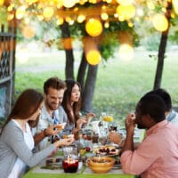 Four Weeks of Thankfulness | Bible Study Resource | Friends celebrating Thanksgiving at a table in fall
