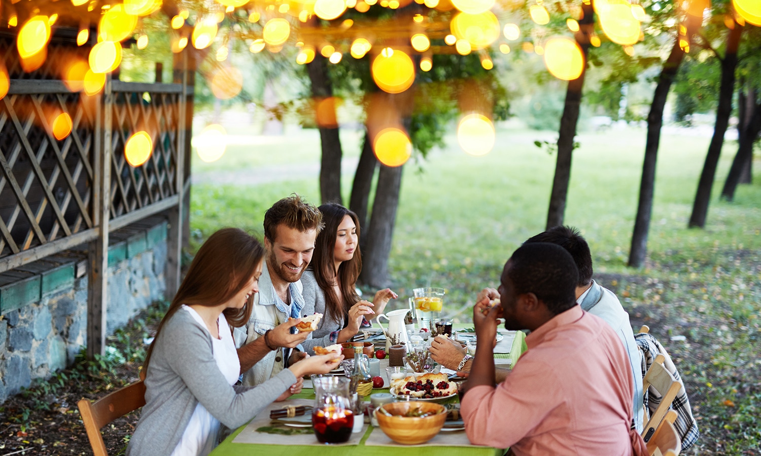 Four Weeks of Thankfulness | Bible Study Resource | Friends celebrating Thanksgiving at a table in fall