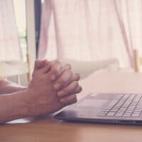 Prayer Teams Make a Difference: God is at Work | The Navigators Collegiate Ministry | Praying hands on a laptop