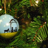 Christmas Hope: Our Inrushing Rescuer | Doug Nuenke | Nativity ornament on a Christmas tree
