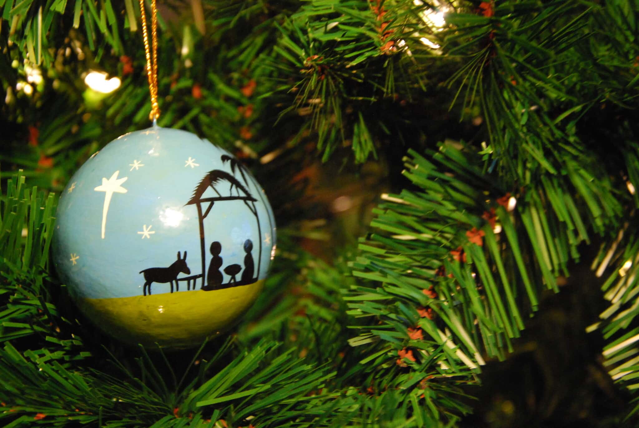 Christmas Hope: Our Inrushing Rescuer | Doug Nuenke | Nativity ornament on a Christmas tree