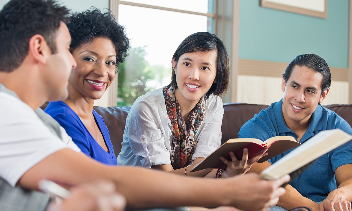 A Life-Changing Encounter with the Gospel of John | The Navigators Bible Study Resource | Group of young adults having discussion during bible study