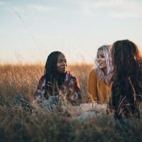 Asking Great Questions to Live Out Scripture | Navigators Bible Study Resource | Three hiker girls taking a rest from long walking through African savanas