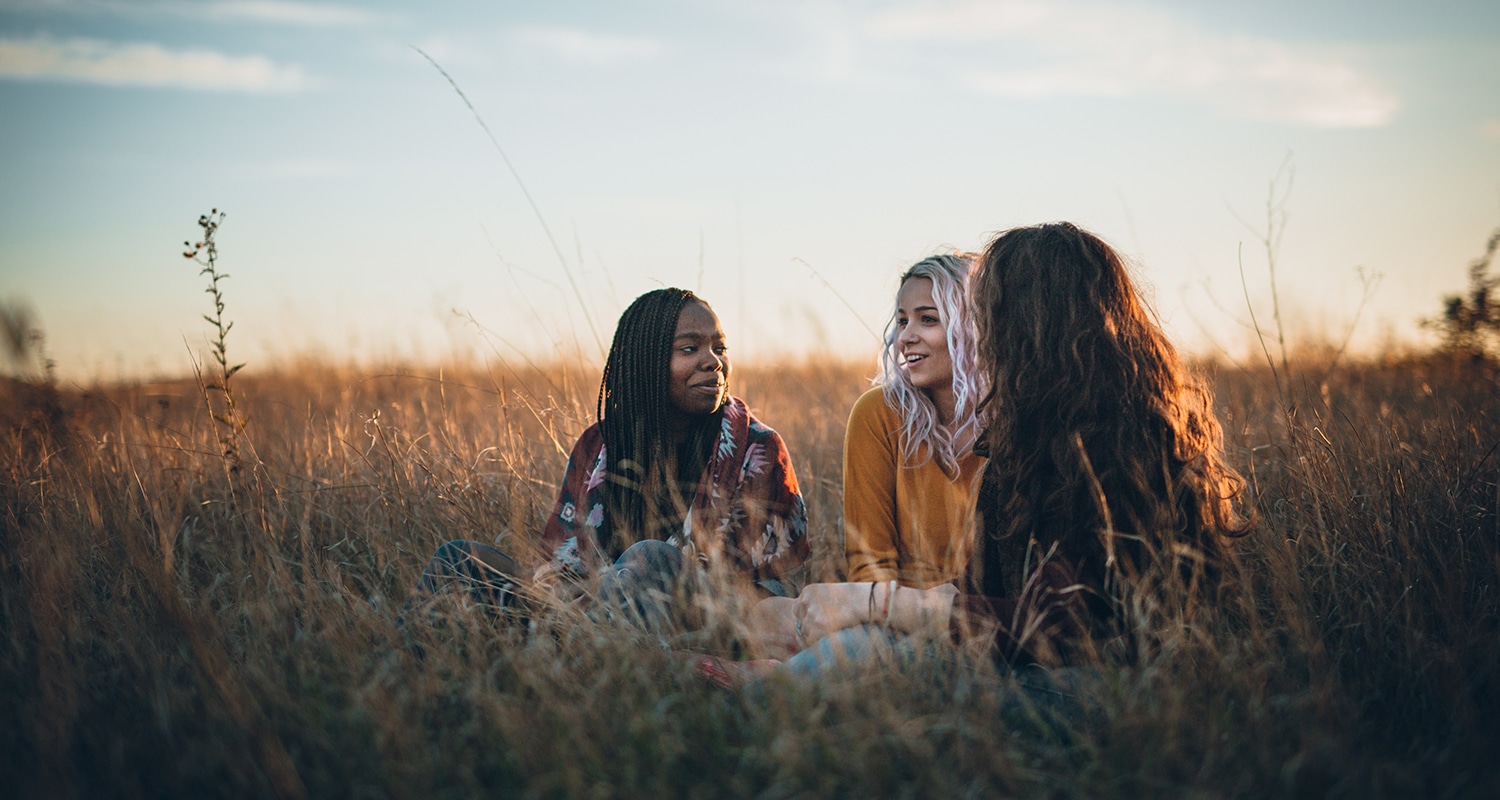 Asking Great Questions to Live Out Scripture | Navigators Bible Study Resource | Three hiker girls taking a rest from long walking through African savanas
