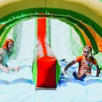 Summer Camp: A Week of Good News and Fun | Eagle Lake Camps | Children having fun on a bounce house in the Summer