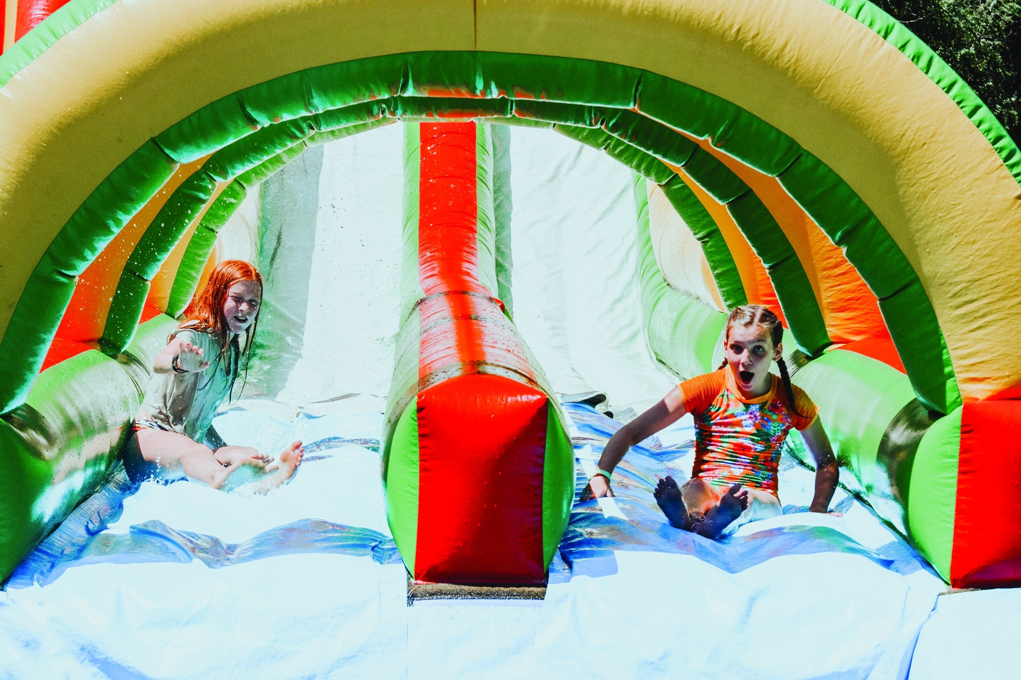 Summer Camp: A Week of Good News and Fun | Eagle Lake Camps | Children having fun on a bounce house in the Summer