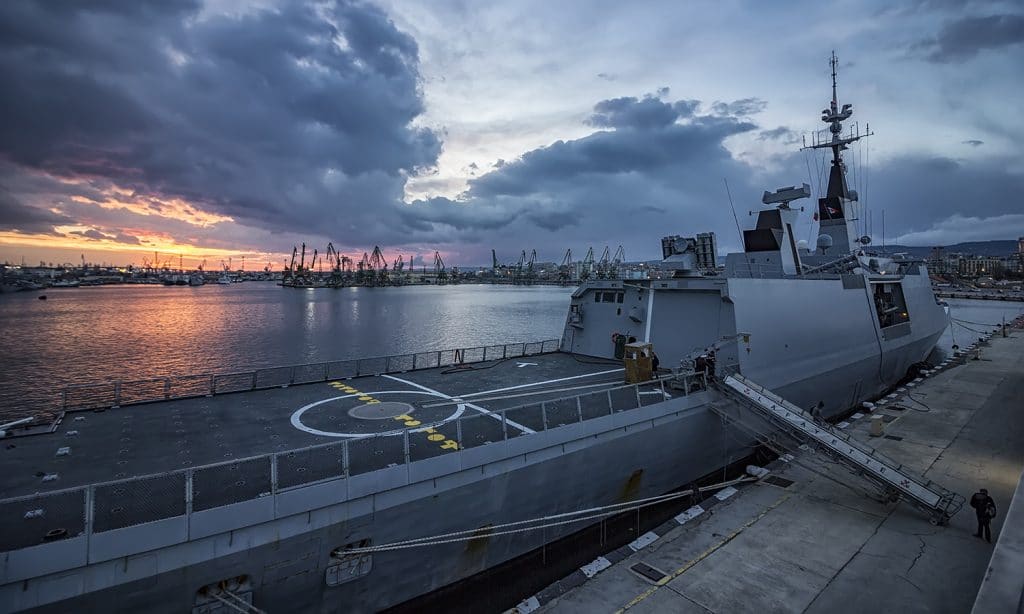 Next Door To Our Military | The Navigators Military | Part of frigate naval forces at sunset at the port