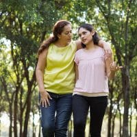 Growing in Identity to Bridge Cultures | The Navigators La Vida Network | Latin mother embracing and walking with daughter