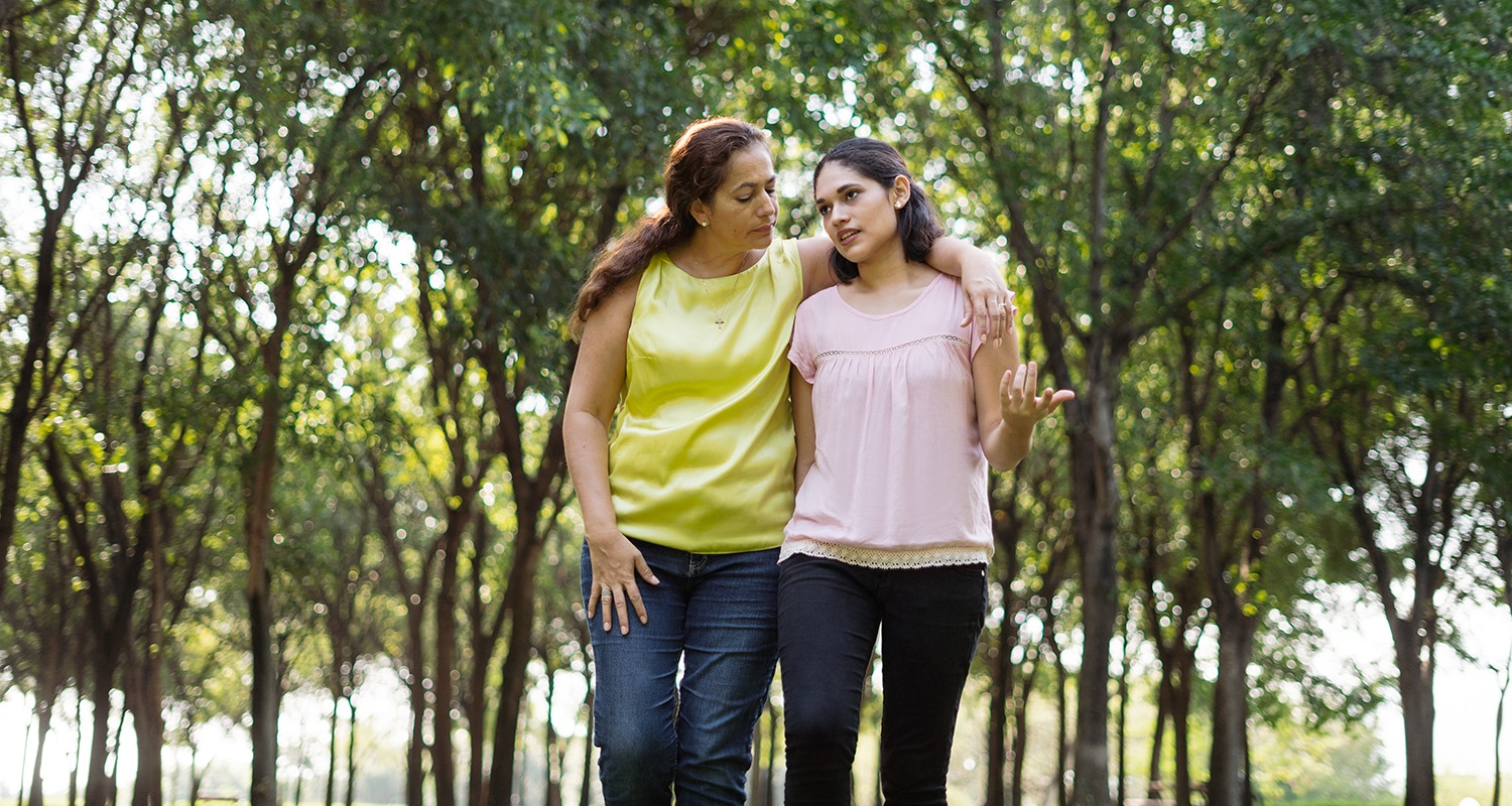 Growing in Identity to Bridge Cultures | The Navigators La Vida Network | Latin mother embracing and walking with daughter