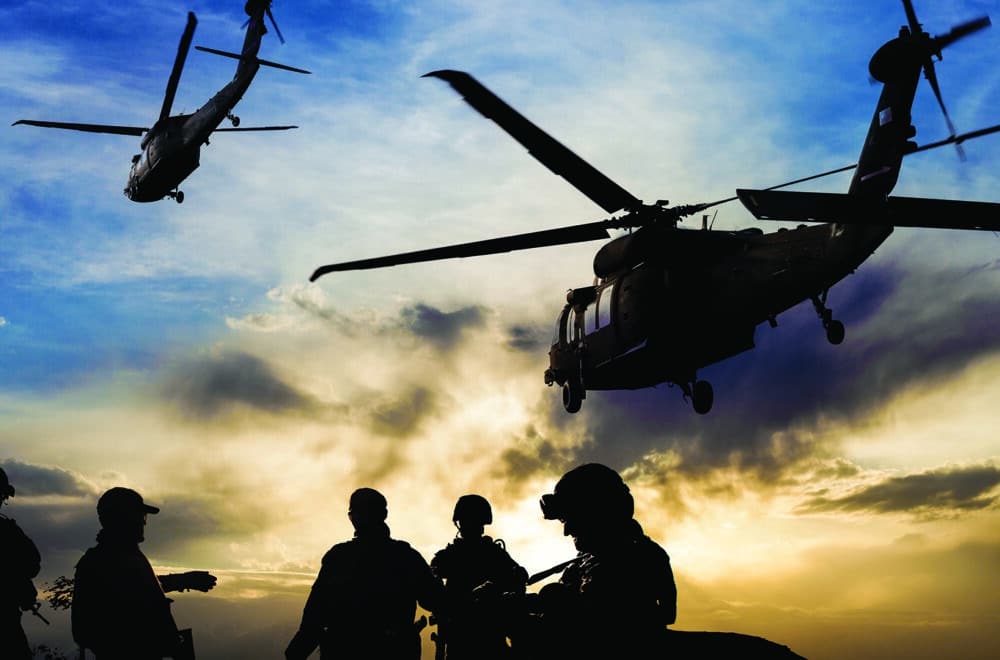 Reaching the Next Generation of Disciplemakers in the Marine Corps | The Navigators Military | Silhouettes of soldiers during Military Mission at dusk