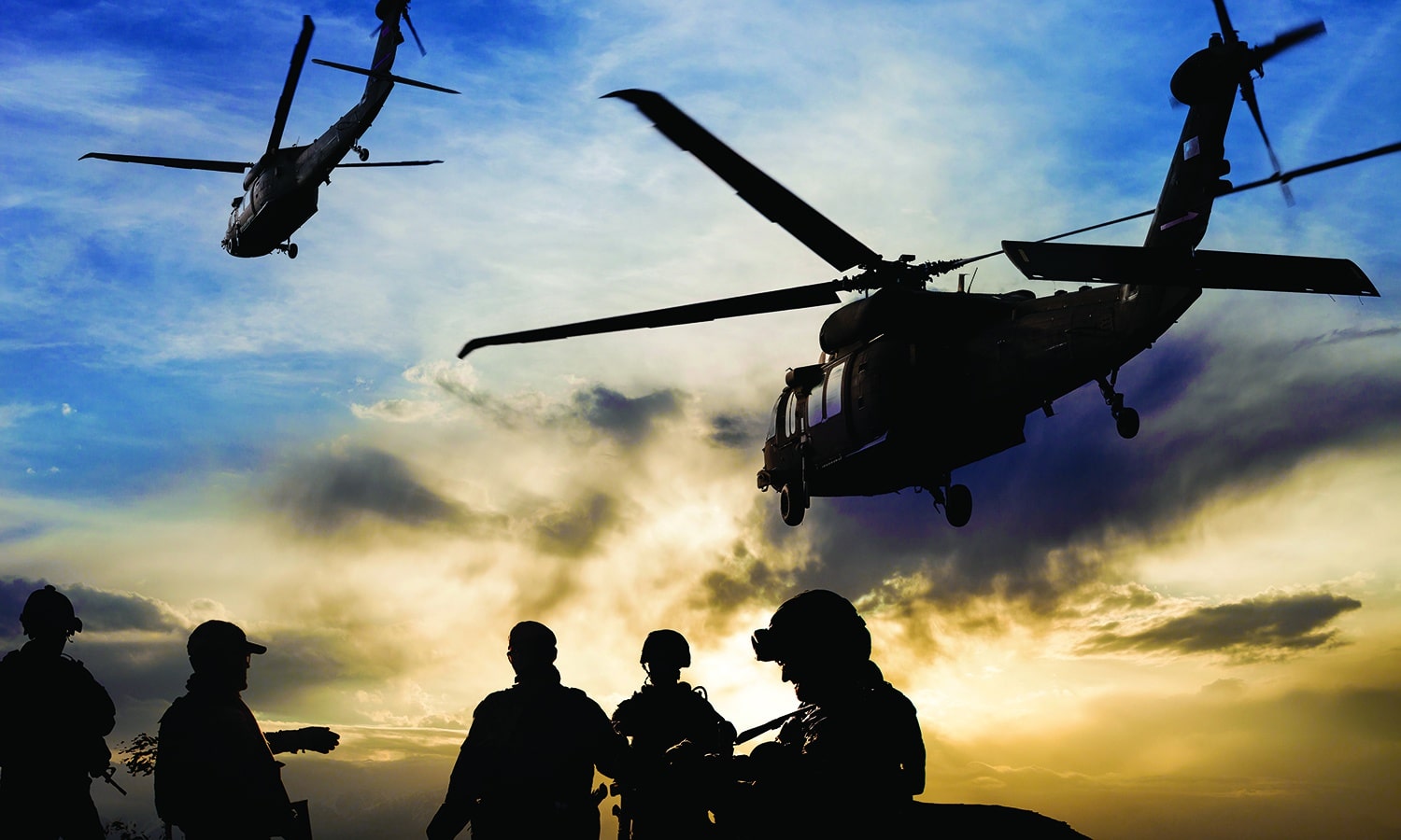 Reaching the Next Generation of Disciplemakers in the Marine Corps | The Navigators Military | Silhouettes of soldiers during Military Mission at dusk