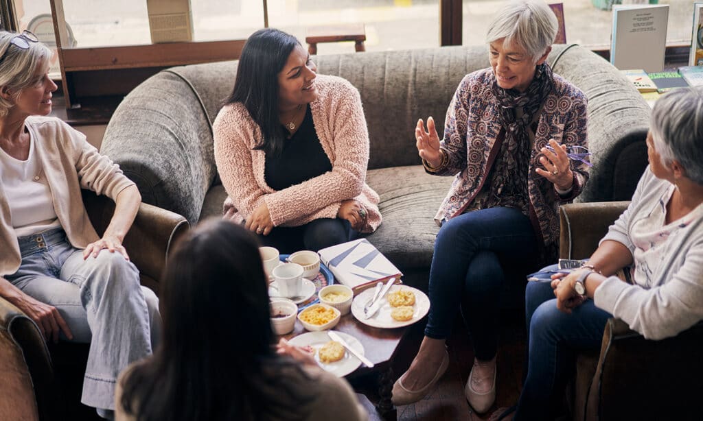 Equipping Women for Multiplication | The Navigators Disciplemaking for Life | Shot of a group of women attending a book club meeting at a bookstore