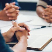 7 Ways to Pray | Navigators Prayer Resource | group of christian are congregants join hands to pray and seek the blessings of God, They were reading the Bible and sharing the gospel with copy space.