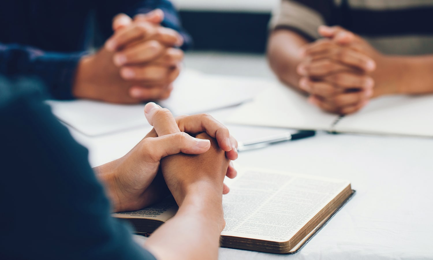 7 Ways to Pray | Navigators Prayer Resource | group of christian are congregants join hands to pray and seek the blessings of God, They were reading the Bible and sharing the gospel with copy space.