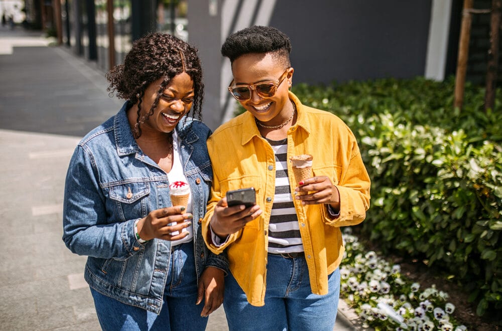 Pregnancy and Parenting Class Leads to Spiritual Transformation | The Navigators Discipling for Development | Using smartphone on the move in the city walk