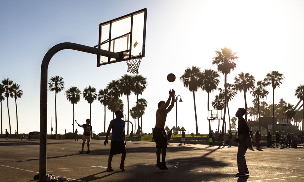 Young Adult Playing Basketball at Venice Beach, Santa Monica, California