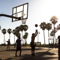 Young Adult Playing Basketball at Venice Beach, Santa Monica, California