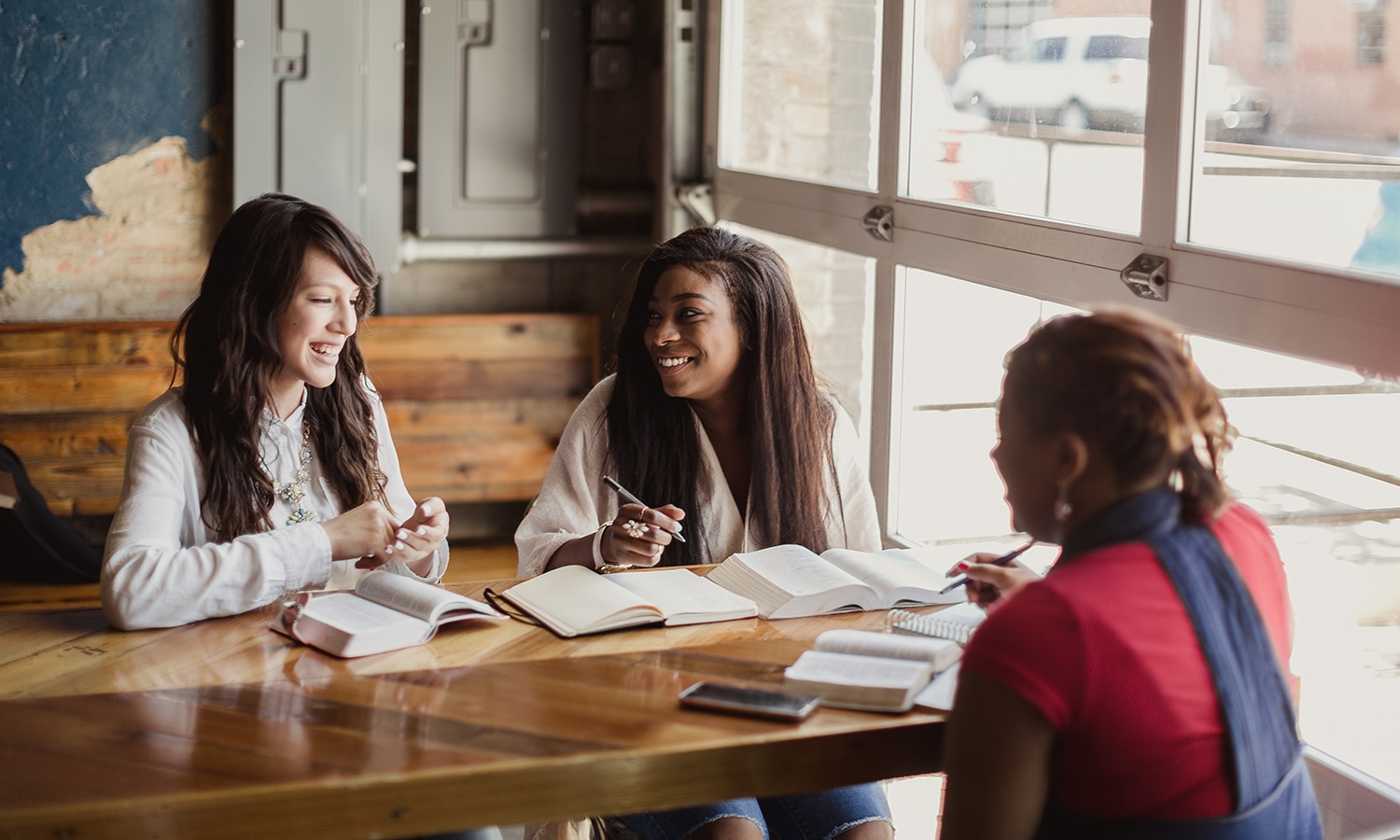 Bible Study Tools | The Navigators Evangelism Resources | Three women studying in a cafe