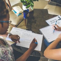 Two women do a bible study together to form a discipleship relationship.