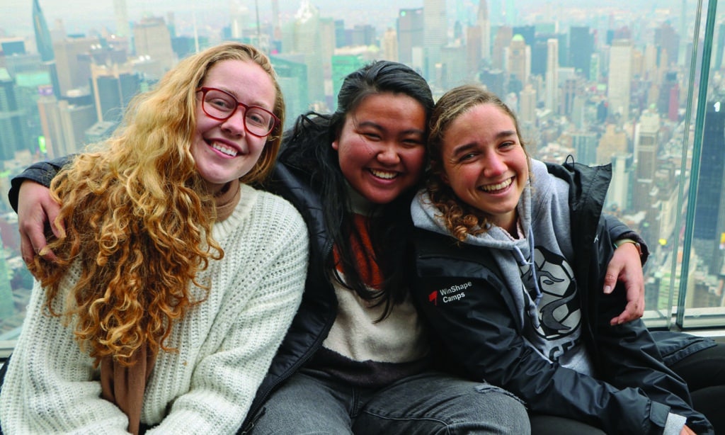 Three female Navigators smile as they reflect on how their faith grew though discipleship.