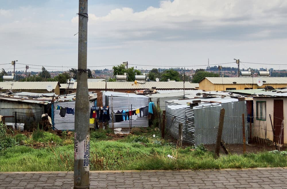 An informal settlement of houses built from metal sheeting in Johannesburg, South Africa.