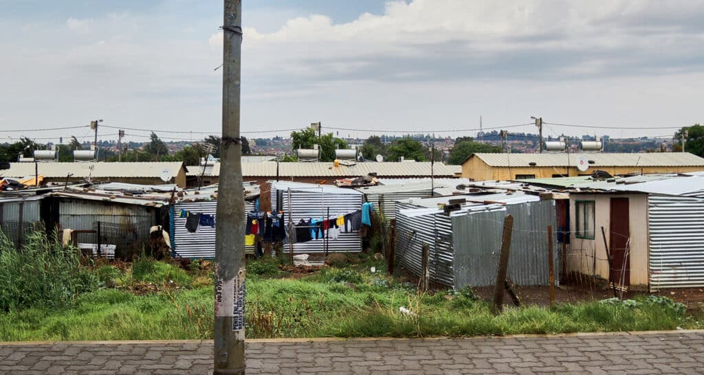 An informal settlement of houses built from metal sheeting in Johannesburg, South Africa.
