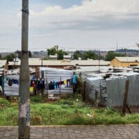 An informal settlement of houses built from metal sheeting in Johannesburg, South Africa.