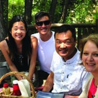 A group of Navigators enjoy a picnic outside as they fellowship together.