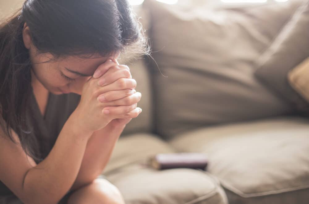 young woman praying