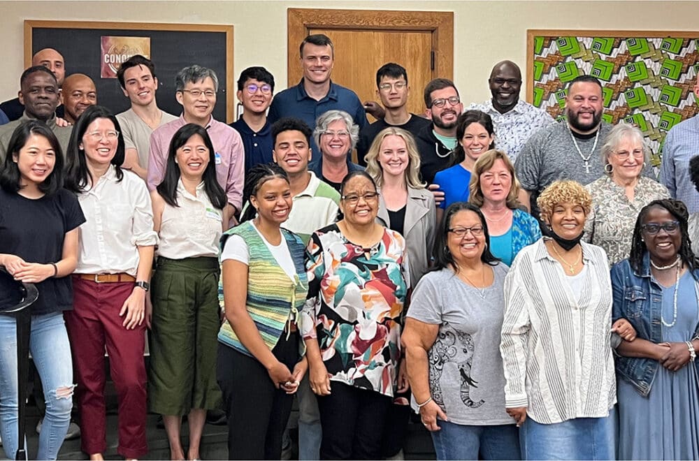 A large group of New York City Navigators smiling for a photo to celebrating their growth in discipleship in the area.